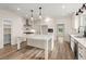 Open kitchen with a large island, stainless steel appliances, and ample storage at 5585 Wire Road, Branchville, SC 29432
