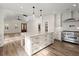 Open-concept living room with island, modern appliances, and beautiful lighting at 5585 Wire Road, Branchville, SC 29432