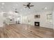 Spacious living room features hardwood floors, a modern fireplace, and an open floor plan at 5585 Wire Road, Branchville, SC 29432