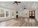 Bright living room with a fireplace, wood floors, and access to the outdoors at 5585 Wire Road, Branchville, SC 29432
