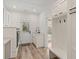 Bright mudroom with sink, cabinets, coat rack and bench, and direct access to the exterior at 5585 Wire Road, Branchville, SC 29432