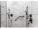 Modern bathroom shower with white subway tile, black fixtures, and a built-in grab bar for accessibility at 5585 Wire Road, Branchville, SC 29432