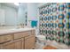 Bathroom featuring vanity with sink, framed mirror, toilet, and tub with an eye-catching shower curtain at 700 Daniel Ellis Dr # 13302, Charleston, SC 29412