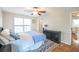 Bedroom with wood-look floors, ceiling fan, and natural light at 700 Daniel Ellis Dr # 13302, Charleston, SC 29412