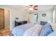 Bedroom featuring ceiling fan, wood-look floors, and easy access to ensuite bath at 700 Daniel Ellis Dr # 13302, Charleston, SC 29412