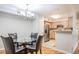 Cozy dining area with hardwood floors, kitchen, and chandelier lighting at 700 Daniel Ellis Dr # 13302, Charleston, SC 29412