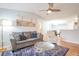 Open concept living area with couch, hardwood floors, and lots of natural light at 700 Daniel Ellis Dr # 13302, Charleston, SC 29412