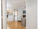 Open-concept living room features hardwood floors, fireplace, and bright, neutral paint at 700 Daniel Ellis Dr # 13302, Charleston, SC 29412