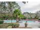Inviting community swimming pool surrounded by lounge chairs and lush landscaping at 700 Daniel Ellis Dr # 13302, Charleston, SC 29412