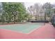 Well-maintained tennis court with nets, set in an apartment community surrounded by trees at 700 Daniel Ellis Dr # 13302, Charleston, SC 29412