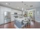 Bright kitchen with white cabinetry, stainless steel appliances, and granite island at 728 York St, Mount Pleasant, SC 29464