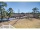 Scenic backyard overlooking the lake and wooden walkway at 7527 Ladys Secret Ln, Awendaw, SC 29429