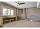 Spacious basement features concrete block walls, a work bench, and a window at 7527 Ladys Secret Ln, Awendaw, SC 29429