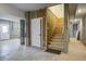 Unfinished basement with stairs leading to the main floor and a door to outside at 7527 Ladys Secret Ln, Awendaw, SC 29429