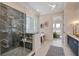 Spa-like bathroom features a glass walk-in shower, soaking tub, and double vanity, creating a luxurious retreat at 7527 Ladys Secret Ln, Awendaw, SC 29429
