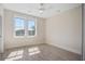 Bright, airy bedroom with a ceiling fan and a double window with natural light at 7527 Ladys Secret Ln, Awendaw, SC 29429