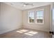 Well-lit bedroom with a ceiling fan and double windows allowing natural light at 7527 Ladys Secret Ln, Awendaw, SC 29429