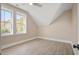 Bright bedroom with two windows and a ceiling fan in an angled ceiling room at 7527 Ladys Secret Ln, Awendaw, SC 29429
