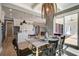 Dining area with modern lighting fixtures and access to the kitchen, great for gatherings and entertaining at 7527 Ladys Secret Ln, Awendaw, SC 29429