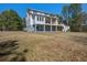 Rear exterior showing house and backyard at 7527 Ladys Secret Ln, Awendaw, SC 29429