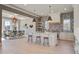 Bright, open kitchen features a large island, modern appliances, and breakfast nook at 7527 Ladys Secret Ln, Awendaw, SC 29429