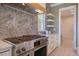 Gourmet range with stainless steel hood and modern backsplash tiles at 7527 Ladys Secret Ln, Awendaw, SC 29429