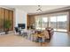 Bright living room boasts a fireplace, ceiling fan, and a sliding glass door that leads to a patio at 7527 Ladys Secret Ln, Awendaw, SC 29429