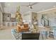 Spacious living room showcasing an open floor plan connecting to the modern kitchen with white cabinetry at 7527 Ladys Secret Ln, Awendaw, SC 29429