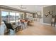 A spacious living room featuring an open concept floor plan, seamlessly connecting to the kitchen and dining area at 7527 Ladys Secret Ln, Awendaw, SC 29429
