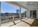 Covered back porch with wooden floors overlooking the lake and backyard at 7527 Ladys Secret Ln, Awendaw, SC 29429