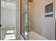 Bathroom shower with tan tiled walls and a patterned inset storage area at 7527 Ladys Secret Ln, Awendaw, SC 29429
