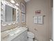 Elegant bathroom featuring marble vanity, decorative mirror, and stylish accents at 78 Nassau St, Charleston, SC 29403