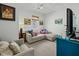 Comfortable bedroom with seating area, cozy decor and bright accents at 78 Nassau St, Charleston, SC 29403