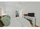 Bright bedroom features a ceiling fan, white walls, and a view into the closet at 78 Nassau St, Charleston, SC 29403