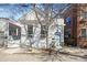 Charming home features a light blue front door and black flower boxes under the windows at 78 Nassau St, Charleston, SC 29403