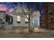 Charming home features a light blue front door and black flower boxes under the windows at 78 Nassau St, Charleston, SC 29403