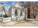 Charming white home featuring window boxes, white picket fence and mature tree at 78 Nassau St, Charleston, SC 29403