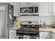 Modern kitchen features stainless steel appliances, granite countertops, and ample cabinet space for a chef's delight at 78 Nassau St, Charleston, SC 29403