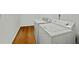 Practical laundry area boasts a washer and dryer set, complemented by durable hardwood flooring for easy maintenance at 78 Nassau St, Charleston, SC 29403