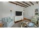 Cozy living room boasts hardwood floors, bright windows, and stylish decor at 78 Nassau St, Charleston, SC 29403