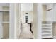 Luxurious bathroom with walk-in closet access, a soaking tub, and modern fixtures at 87 Dungannon Hall, Kiawah Island, SC 29455