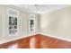 Bright bedroom with hardwood floors and windows fitted with white shutters at 87 Dungannon Hall, Kiawah Island, SC 29455