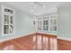 Bright bedroom with large windows and hardwood floors, offering plenty of natural light at 87 Dungannon Hall, Kiawah Island, SC 29455