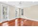 Bright bedroom with hardwood floors, large windows, and a ceiling fan, offering a comfortable and inviting space at 87 Dungannon Hall, Kiawah Island, SC 29455