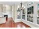 Dining room featuring a view of the backyard, a fireplace, and built-in shelves and wood floors at 87 Dungannon Hall, Kiawah Island, SC 29455