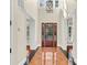 Grand foyer featuring elegant chandelier and decorative tile flooring at 87 Dungannon Hall, Kiawah Island, SC 29455