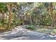 Charming home with a two-car garage surrounded by lush landscaping and mature trees at 87 Dungannon Hall, Kiawah Island, SC 29455