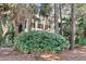 Charming home with a porch and lush landscaping and mature trees at 87 Dungannon Hall, Kiawah Island, SC 29455