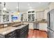 Modern kitchen featuring stainless steel appliances, granite counters, breakfast bar and lots of natural light at 87 Dungannon Hall, Kiawah Island, SC 29455