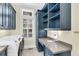 Well-equipped laundry room with custom cabinetry and modern appliances at 87 Dungannon Hall, Kiawah Island, SC 29455